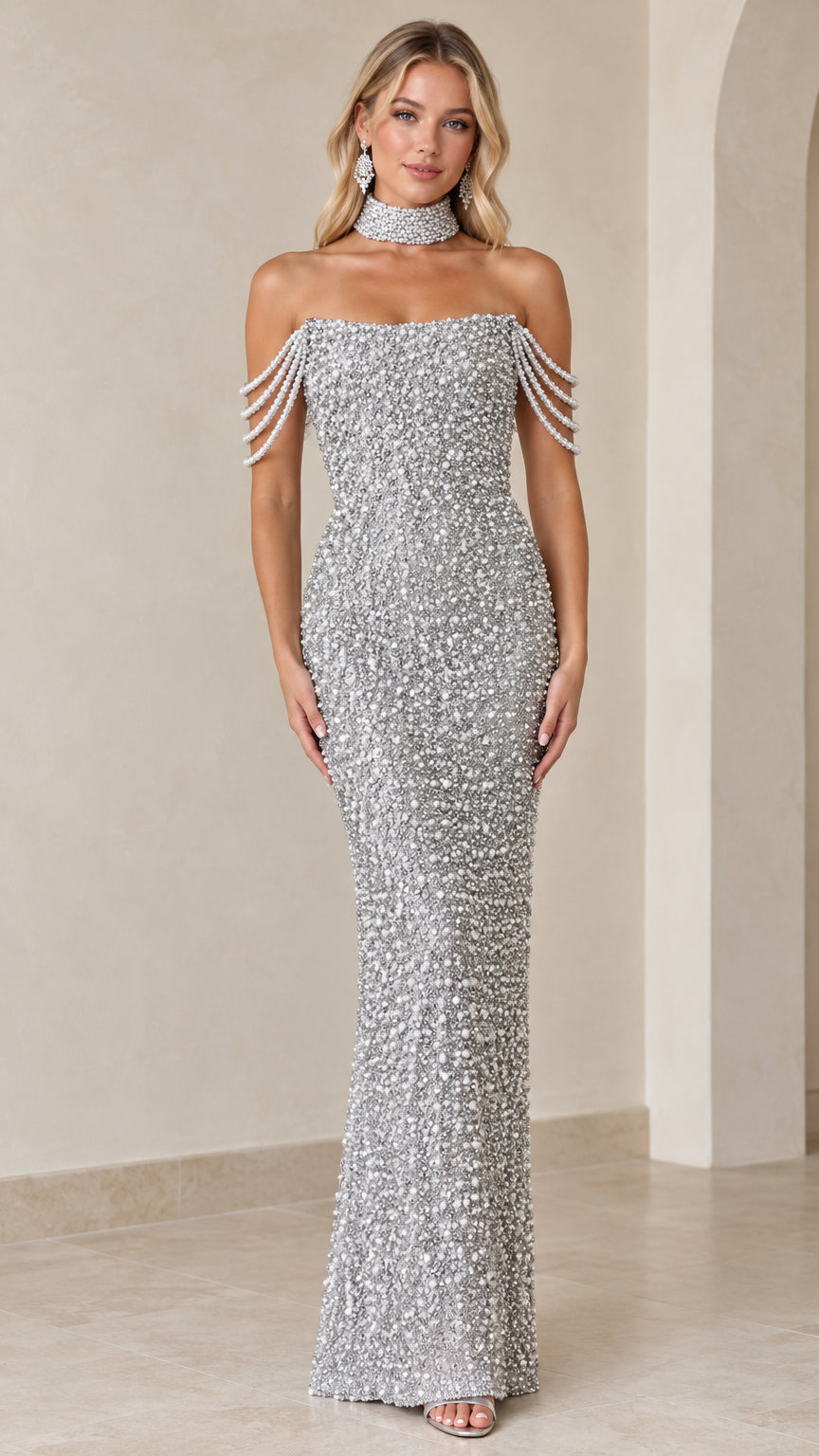 Front view of model wearing a silver pearl-embellished maxi gown with draped shoulder strands and choker