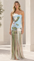 Front full-length view of model wearing the strapless light blue maxi gown with botanical embroidery and fringe skirt