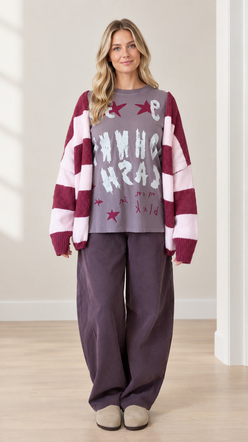 Full front view of model wearing purple 3-piece casual set with striped cardigan and wide leg pants
