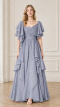 Front view of woman wearing dusty blue flutter sleeve ruffle evening maxi dress