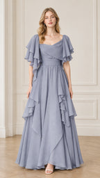 Front view of woman wearing dusty blue flutter sleeve ruffle evening maxi dress