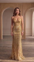 Front full-length view of model wearing gold strapless sequin corset mermaid evening gown