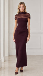 Front view of model wearing burgundy sheer cowl neck column maxi evening gown