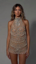 Model wearing Champagne halter neck beaded fringe mini dress front view