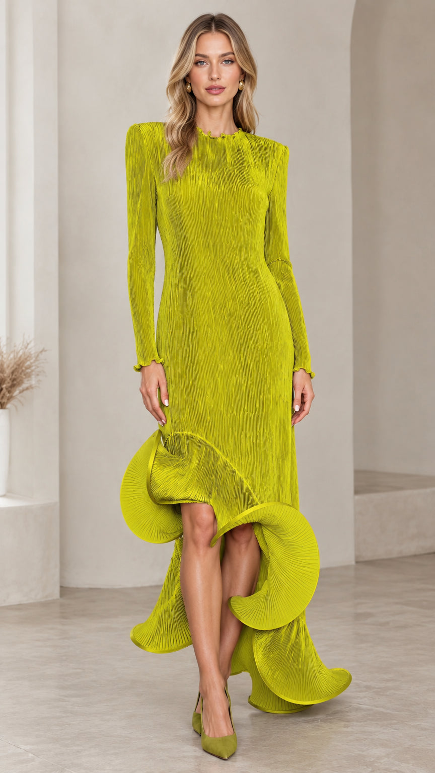 Front view of model wearing a chartreuse pleated long sleeve maxi dress with an asymmetrical ruffle hem
