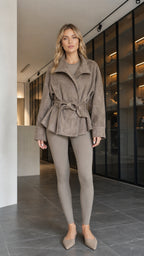 Front view of model wearing taupe faux suede belted wrap jacket with matching leggings