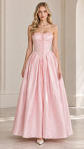 Front view of model wearing pink strapless corset ball gown maxi dress