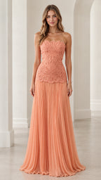 Front view of model wearing peach strapless lace bodice pleated maxi dress
