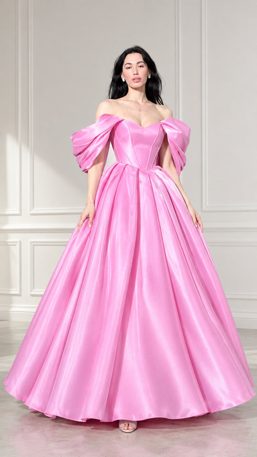 Front view of woman wearing pink off-the-shoulder corset satin ball gown with puff sleeves