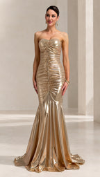 Front full-length view of woman wearing strapless gold metallic ruched mermaid evening gown