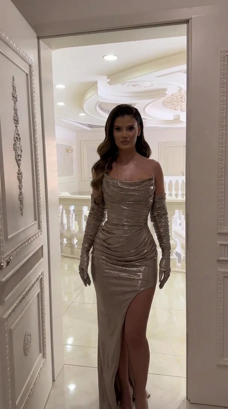 Front view of model wearing champagne metallic strapless ruched corset maxi skirt set with matching gloves