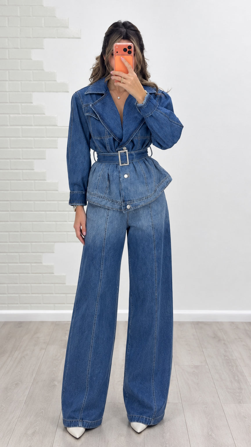 Front view of model wearing blue belted denim jacket and wide-leg jeans set