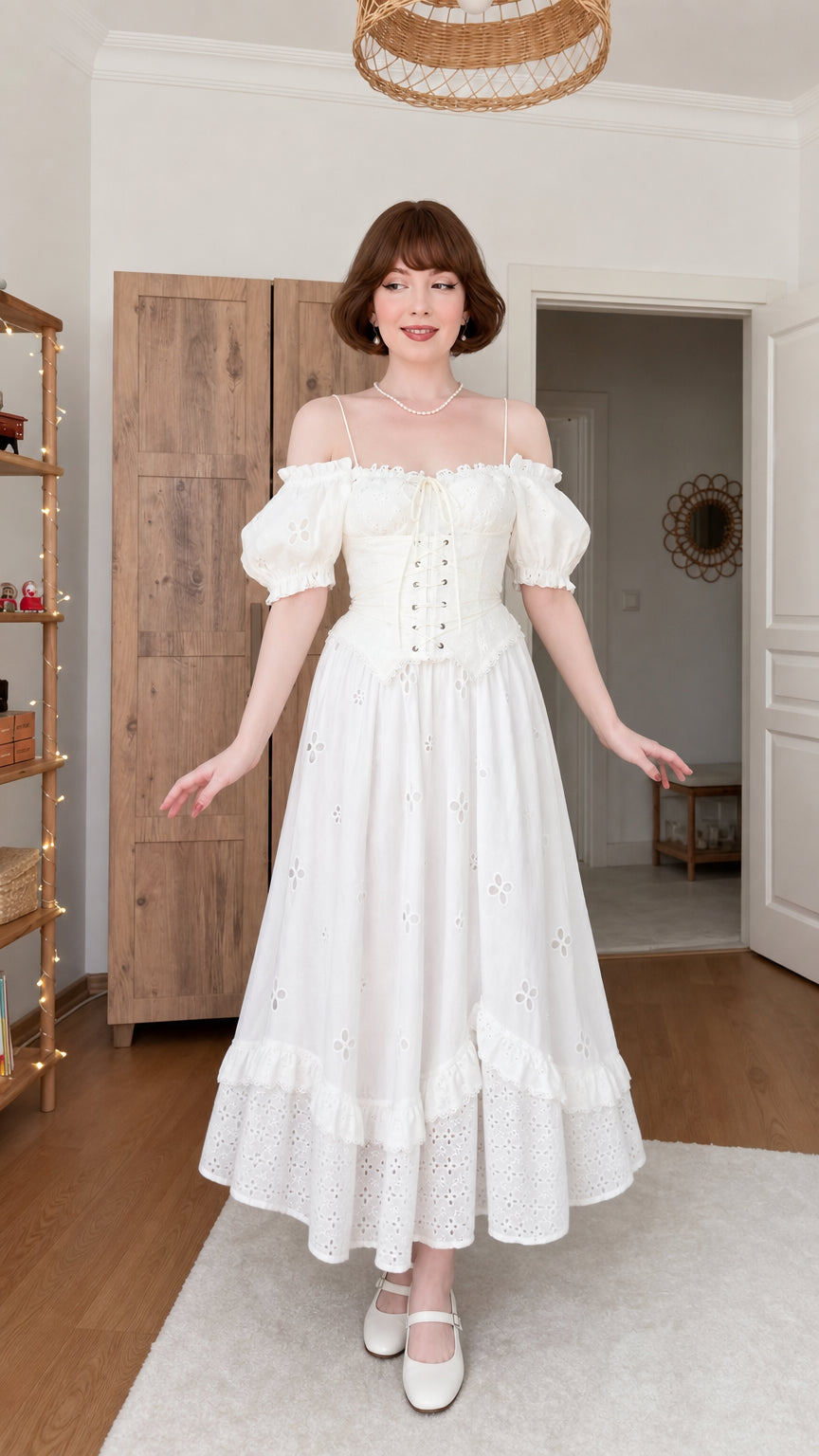 Front view of woman wearing white off-shoulder lace-up corset eyelet midi dress with puff sleeves