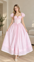 Front full view of woman wearing pink corset bodice flutter sleeve maxi dress