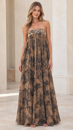 Front view of model wearing tan floral print strapless empire waist maxi dress