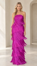 Front full-length view of model wearing magenta strapless tiered fringe maxi dress