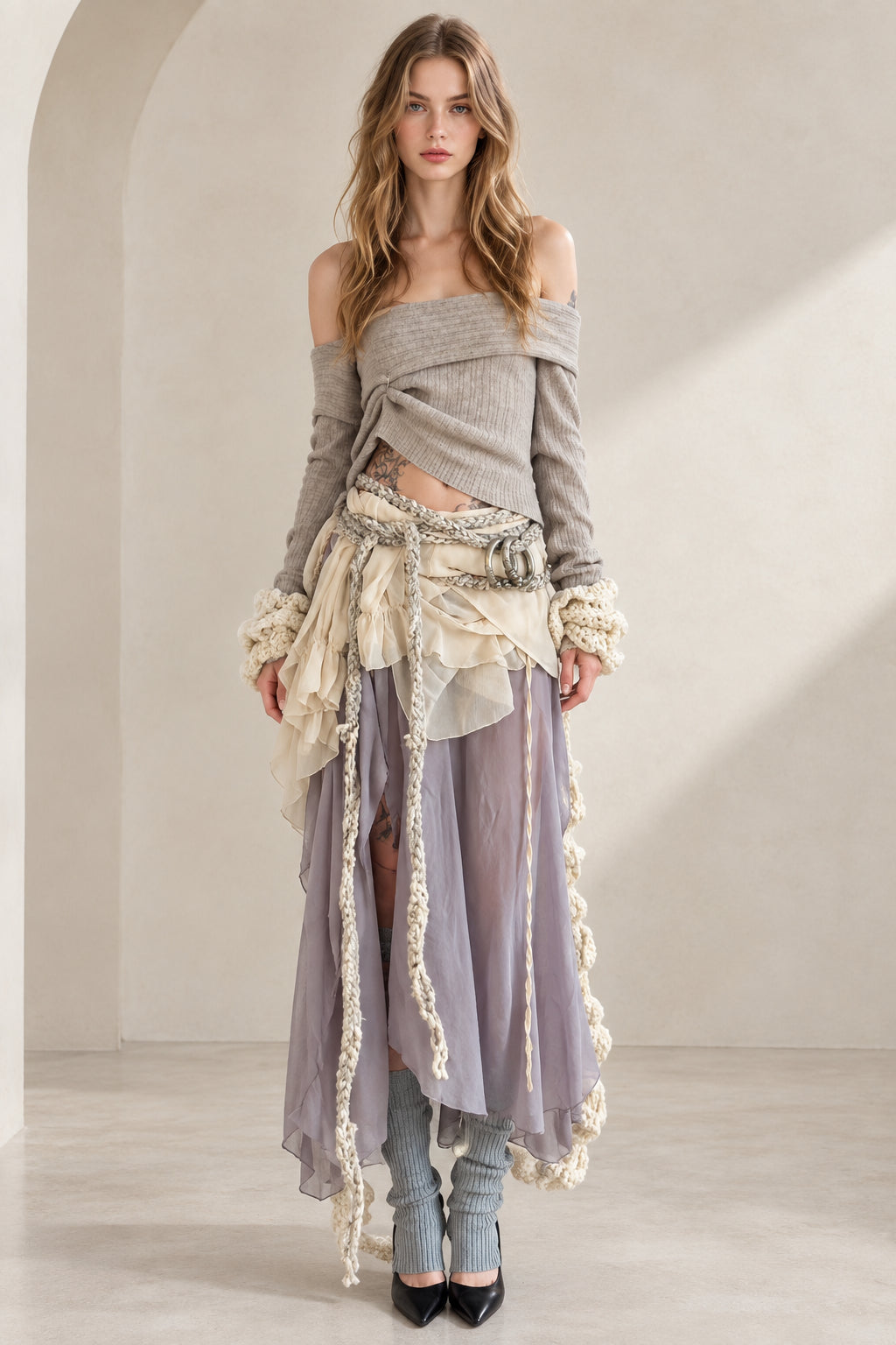 Full front view of model wearing Lavender Grey off-shoulder knit top and layered ruffle maxi skirt set