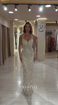 Front full view of woman wearing Champagne sequin halter neck evening gown