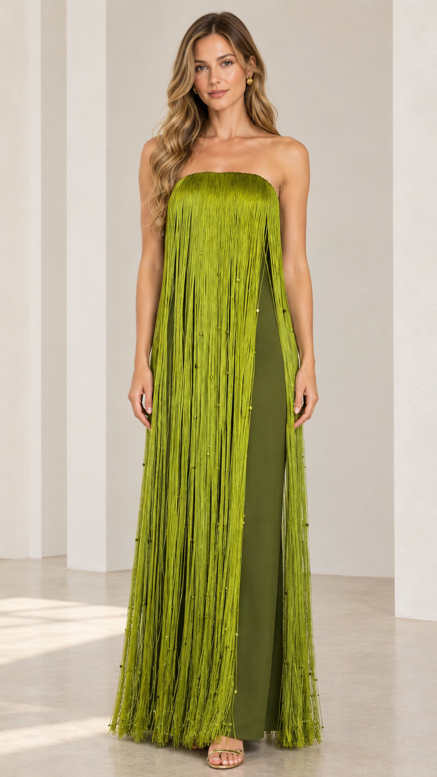 Full front view of model wearing strapless olive green fringe maxi dress