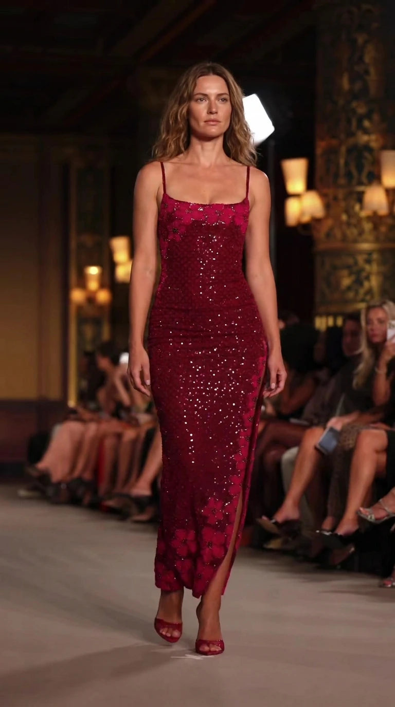 Front full-length view of model walking runway in a Wine Red floral sequin spaghetti strap maxi dress