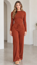 Full front view of model wearing rust long sleeve top and wide leg pants loungewear set