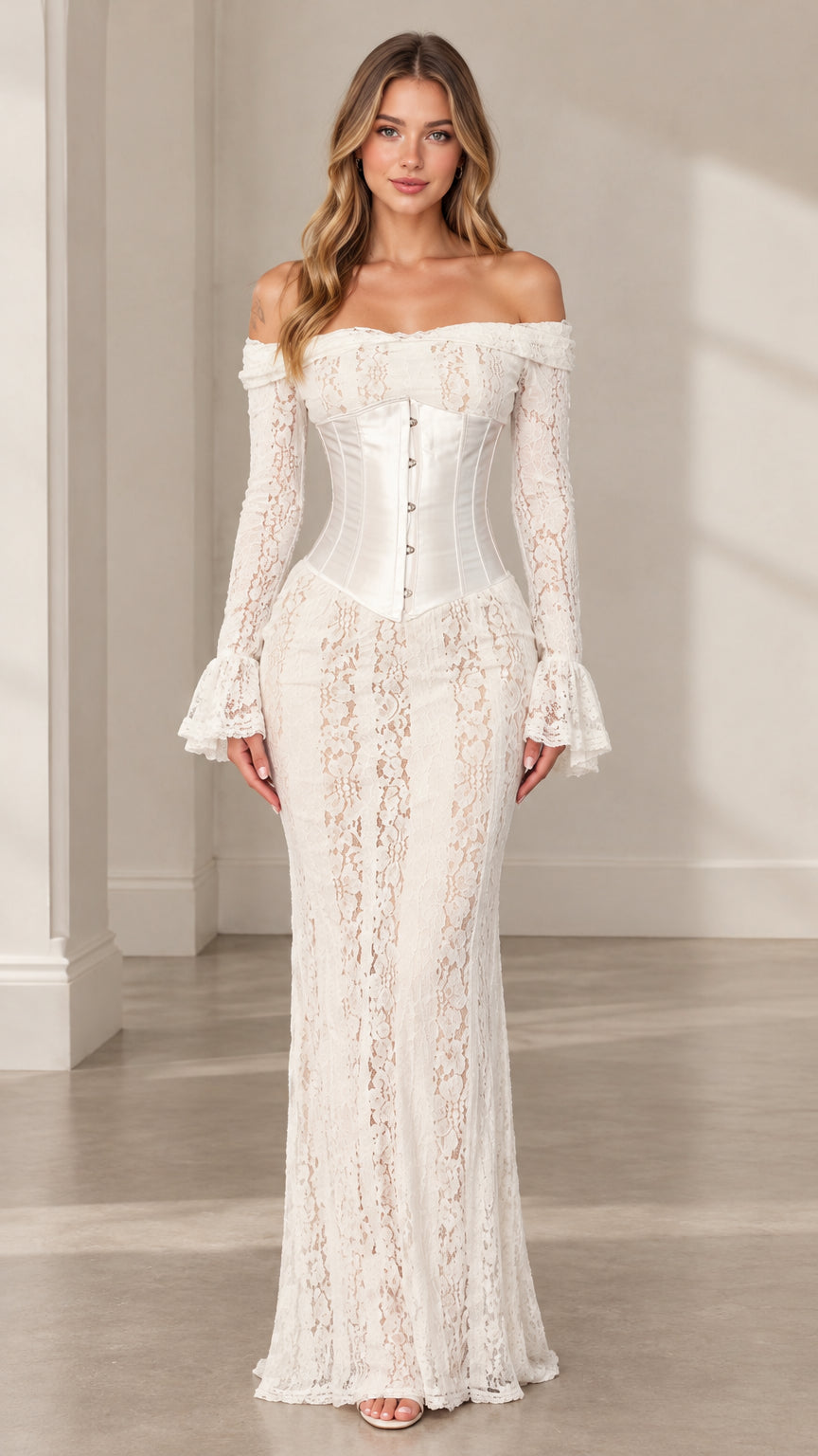 Front view of woman wearing white off-the-shoulder lace corset maxi dress with bell sleeves