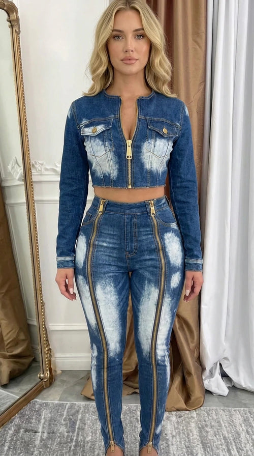 Model wearing blue acid wash cropped denim jacket and front zip skinny pants set - front view