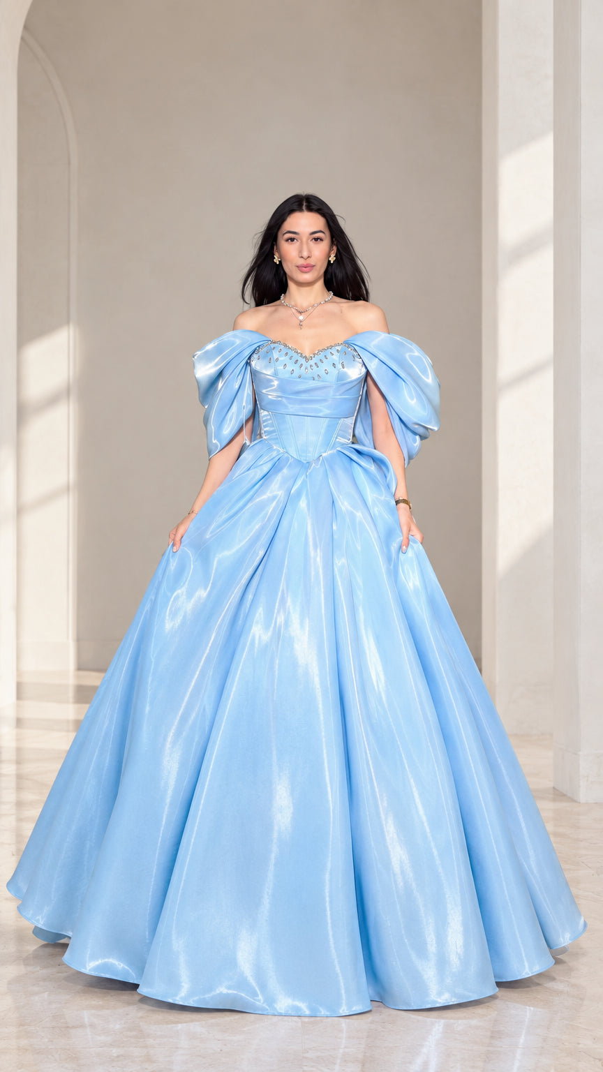 Front view of model wearing a sky blue off-shoulder corset ball gown with puff sleeves