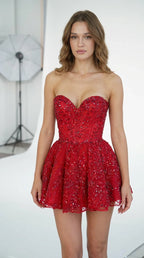 Front view of woman wearing red strapless beaded corset mini dress