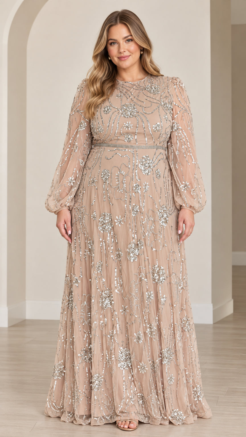 Front full view of woman wearing champagne sequined long sleeve maxi evening gown