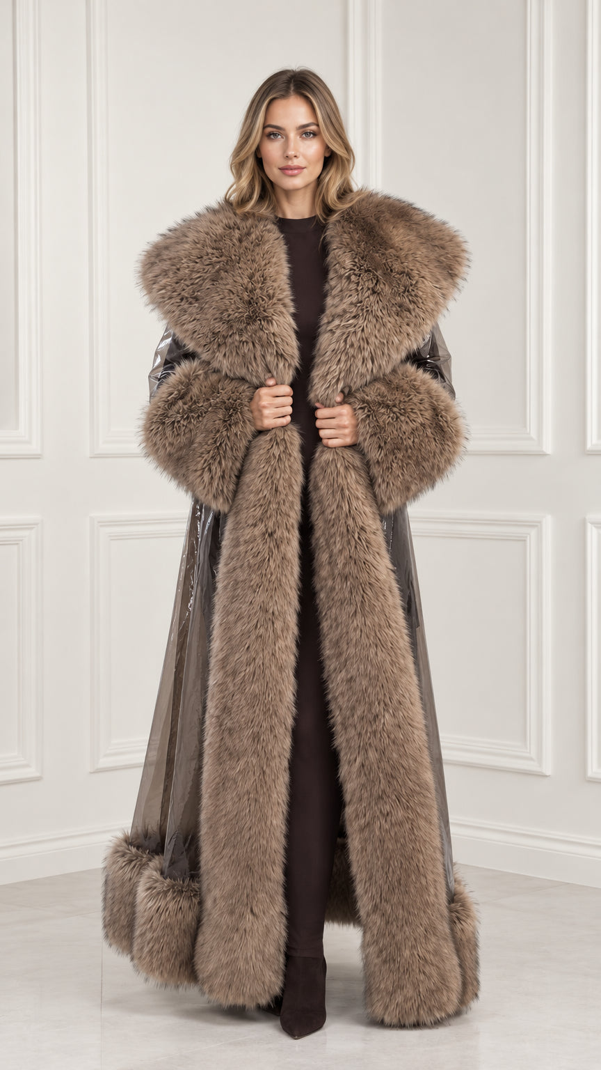 Front view of woman wearing taupe brown glossy maxi trench coat with plush faux fur collar, cuffs, and hem