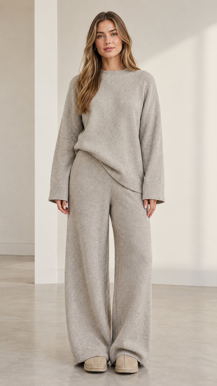 Front view of model wearing heather grey ribbed knit crewneck sweater and wide-leg pants set