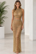 Front view of model wearing gold sequin beaded two-piece maxi dress set