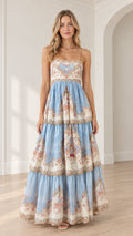 Front view of model wearing a light blue vintage floral tiered cami maxi dress