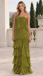 Front view of model wearing olive green strapless tiered fringe maxi dress on outdoor terrace