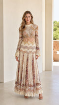 Full front view of model wearing cream floral lace maxi dress with flared long sleeves