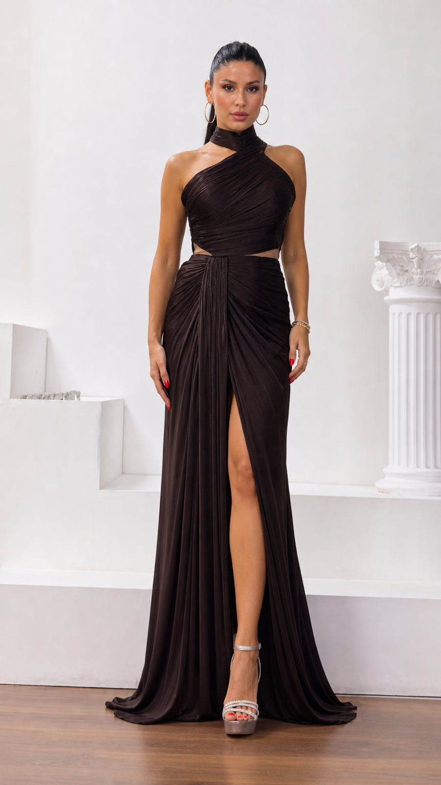 Front full view of dark brown halter neck cutout ruched maxi evening gown with high slit
