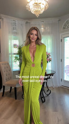 Front view of model wearing lime green plunging neckline long sleeve evening maxi dress with ring detail