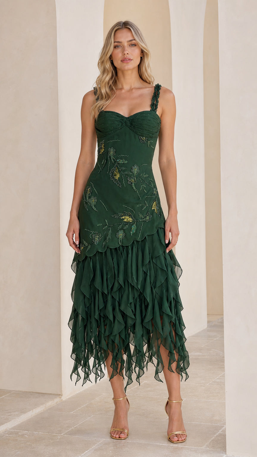 Front view of woman wearing emerald green beaded sweetheart midi dress with tiered ruffle skirt