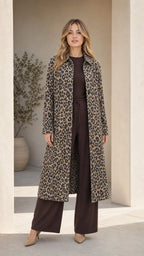 Front view of woman wearing Classic Tan leopard print longline duster coat