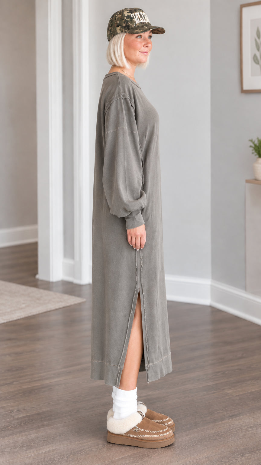 Side profile view of the relaxed washed olive maxi sweatshirt dress showing the high leg slit