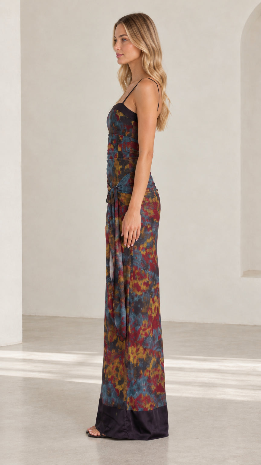Side profile view of model wearing Navy Multi abstract floral spaghetti strap maxi dress