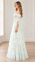 Side profile view of woman modeling Mint Green corset gown showing cascading ruffled skirt