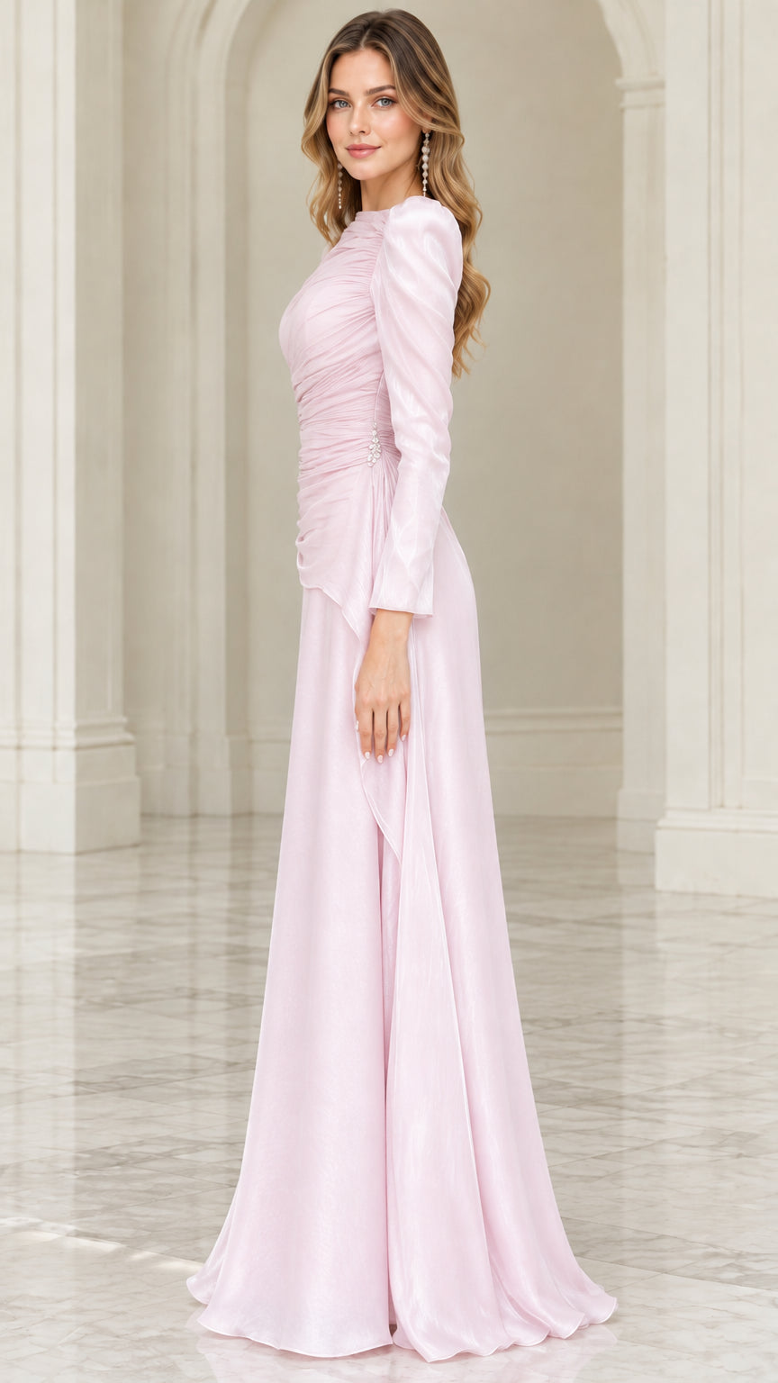 Side profile view of blush pink floor length formal gown showing flowing silhouette