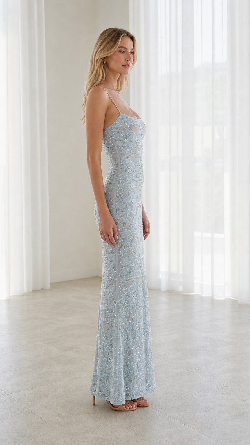 Side profile view of model wearing Light Blue floral lace evening gown