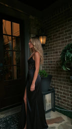 Side angle view of black corset satin evening gown with lace boned bodice