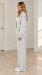 Side profile view of model wearing heather grey two-piece knit lounge set