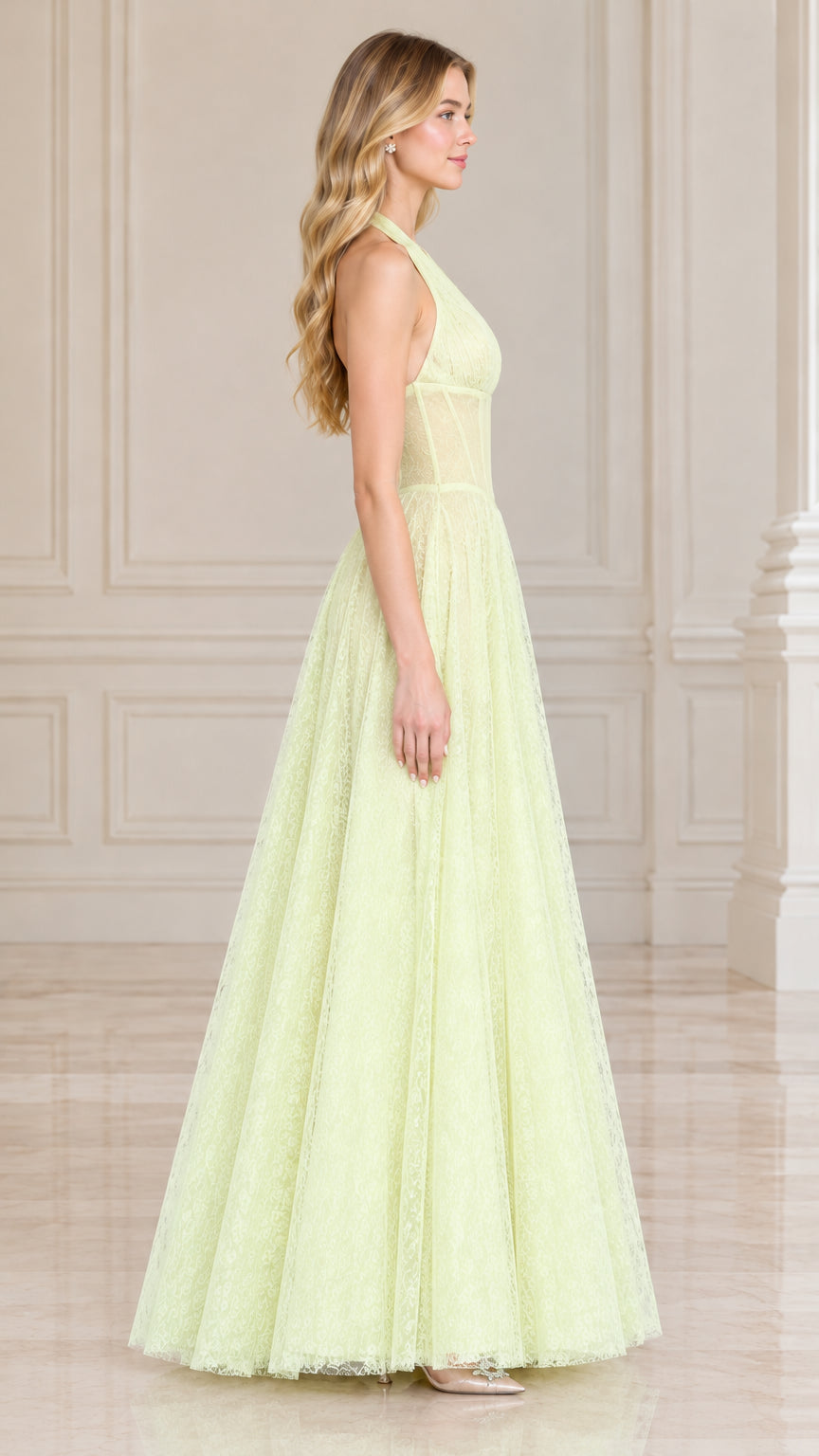 Side profile of model wearing light yellow halter corset lace evening gown