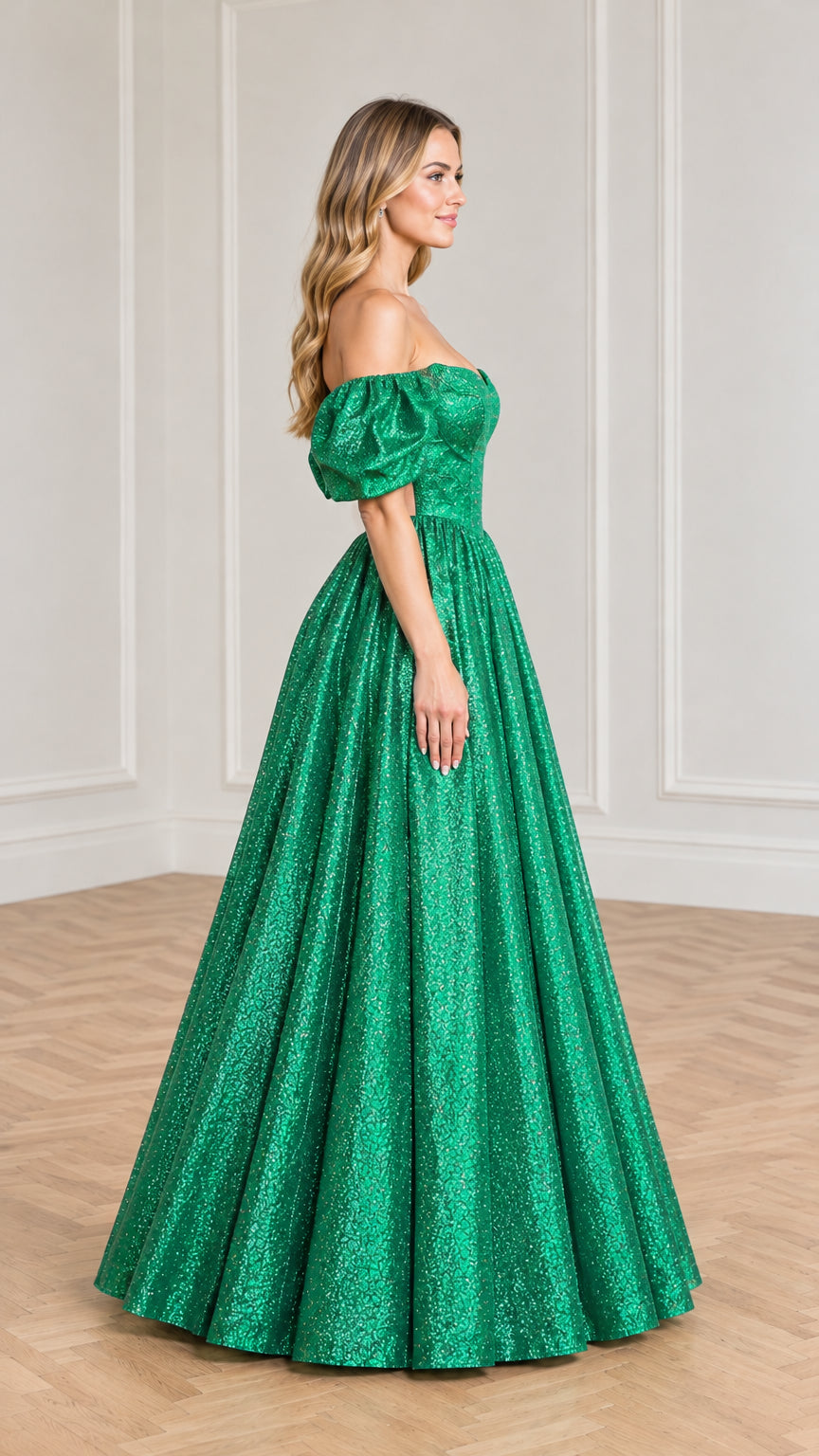 Side profile of emerald green off-shoulder sparkle evening dress with voluminous pleated skirt