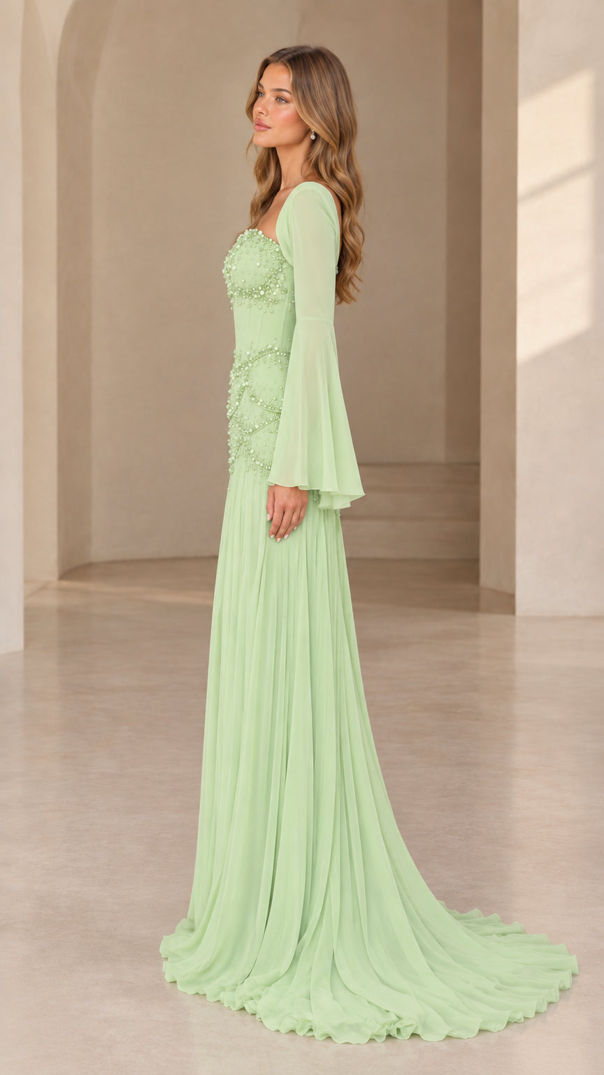 Mint green bell sleeve formal gown side view showing flowing skirt train